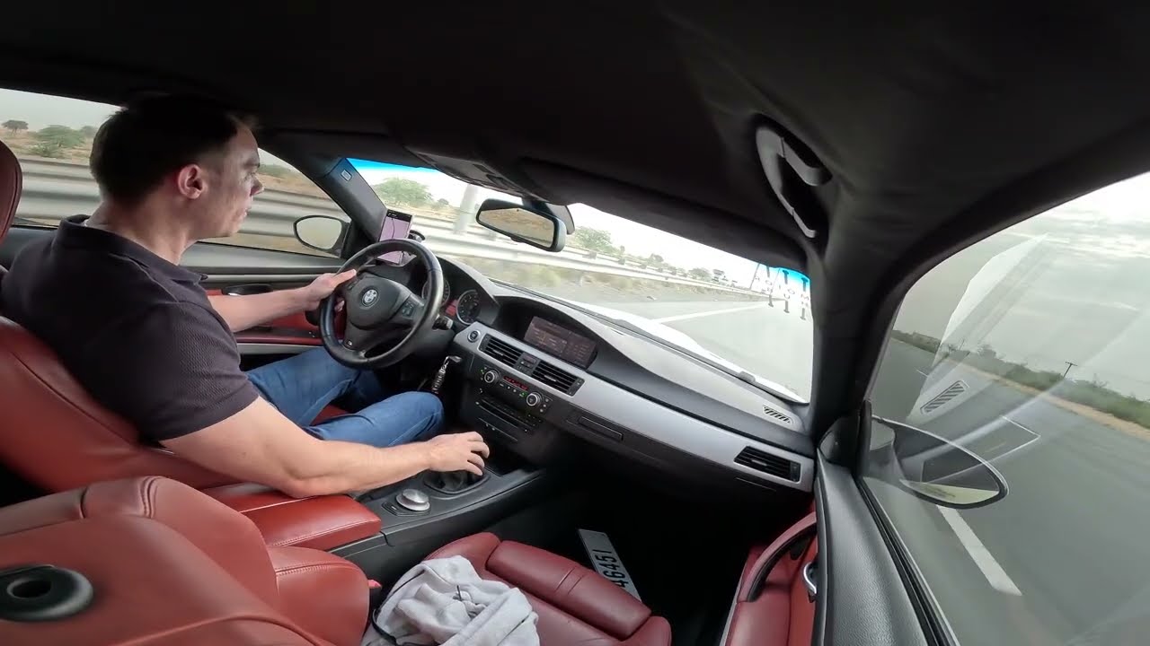 2009 BMW E92 M3 manual vs 2005 E55 AMG roll race
