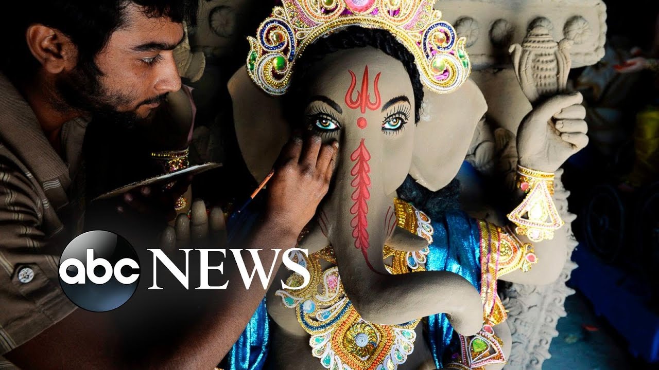 Hindu festival, 'Tomatina' and football match: World in Photos, Aug. 28