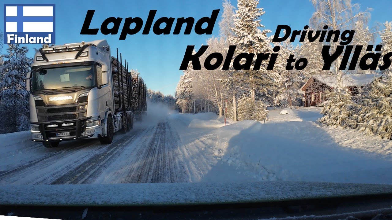 Driving through snowy landscape of Lapland Finland from Kolari to Yll&auml;s on icy road