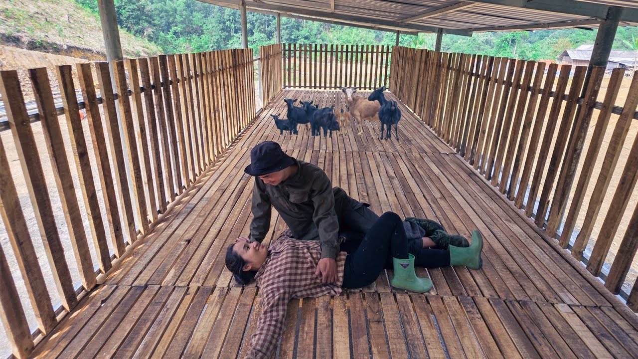 BUILDING A GOAT SHED: Phan & Chieu put in the effort and enjoyed the moment of completion.