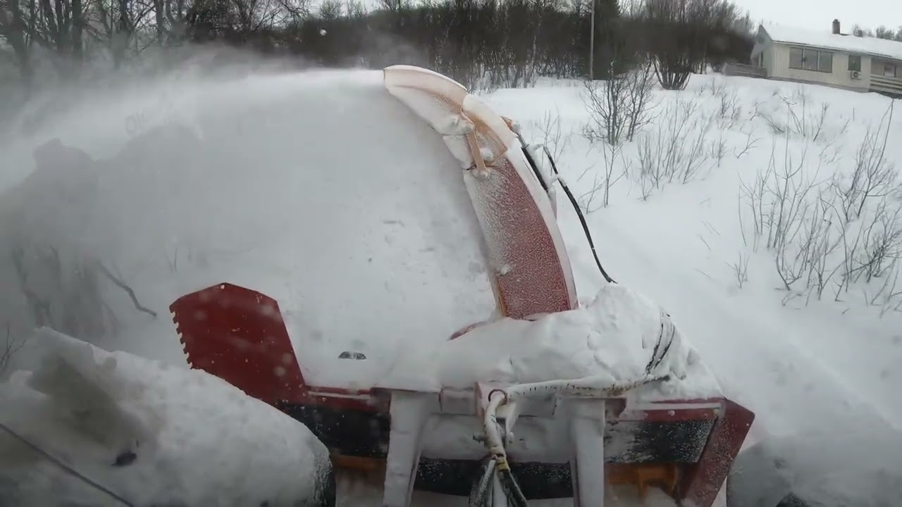 Clearing snow at the Edge of the Arctic Circle