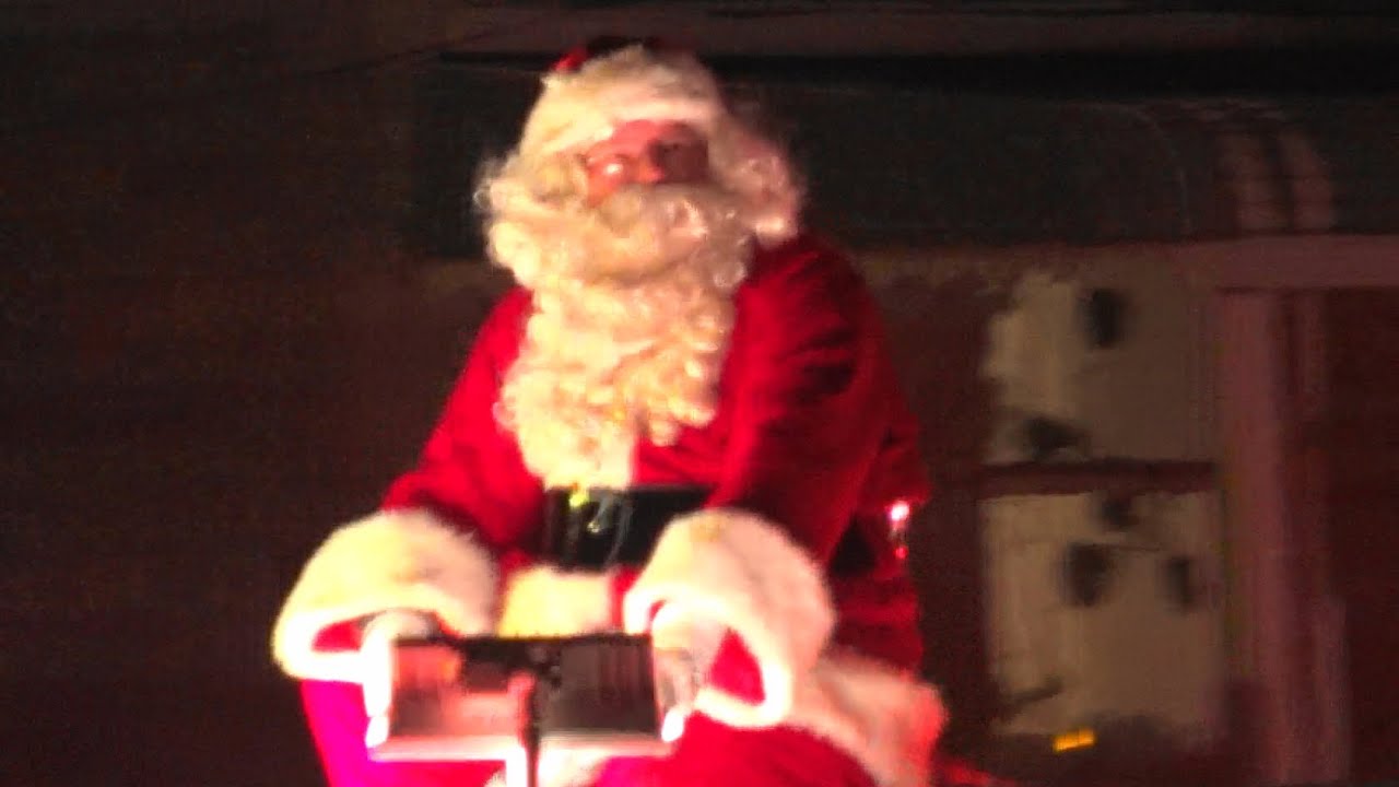 🚒 Santa Claus Riding Atop a Fire Truck  🎅