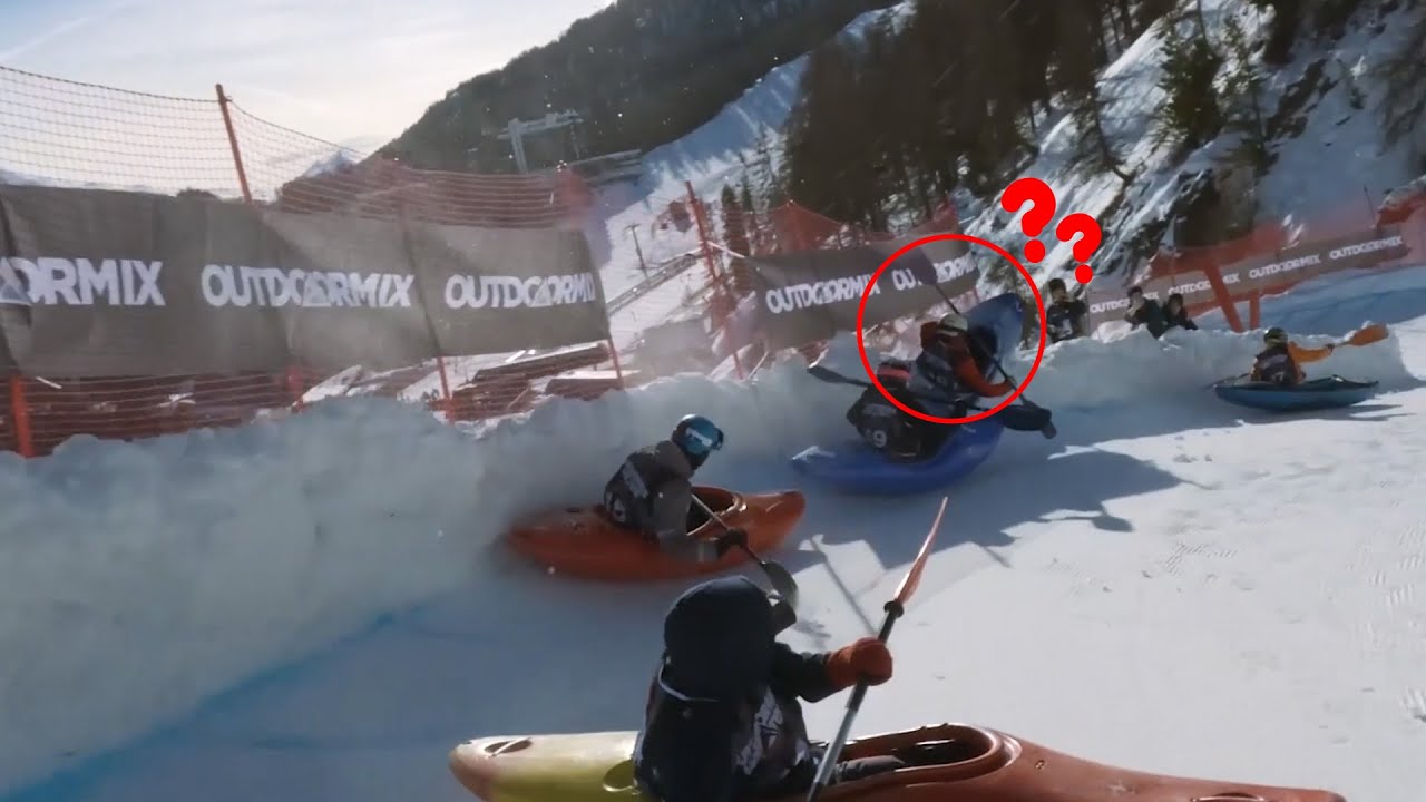 Adrenaline junkies kayaking down snowy mountain