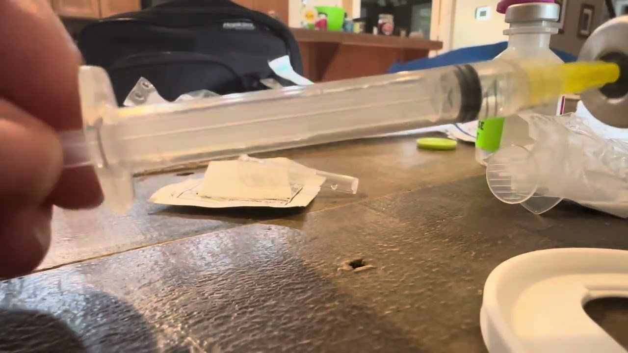 Drawing medication from a vial with fluid dispensing connector - diluting and administering