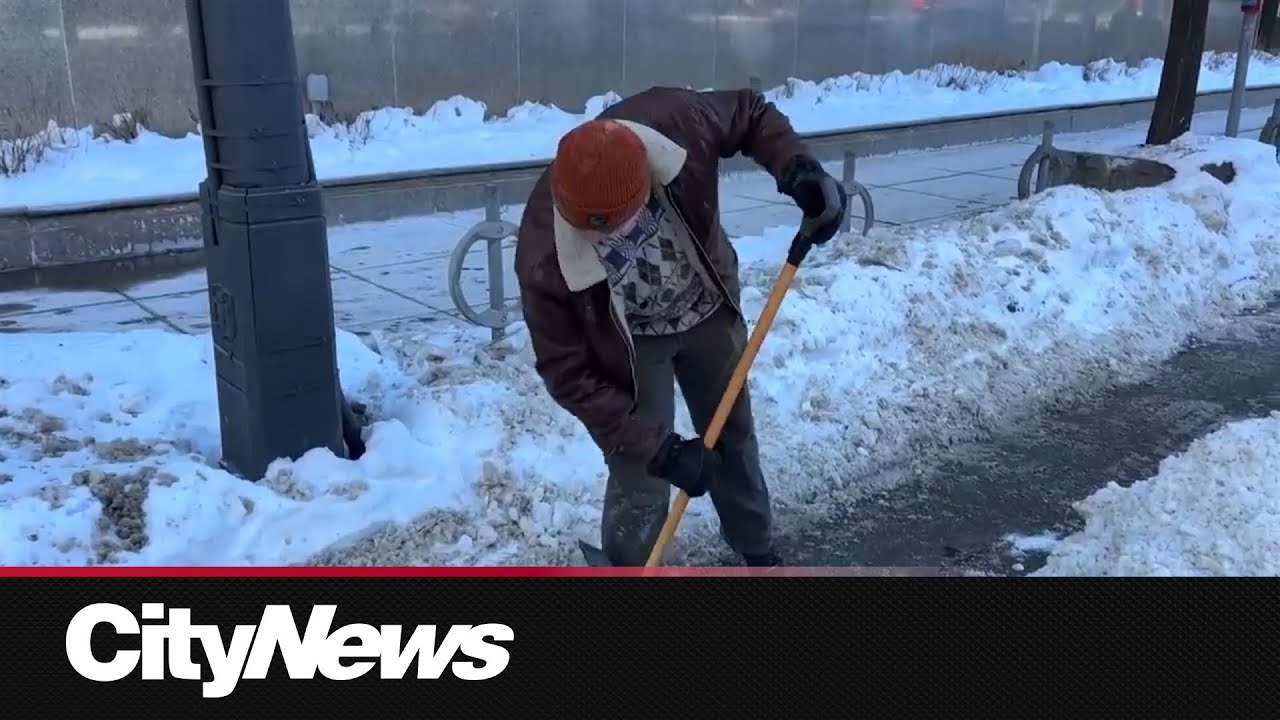 Toronto man takes orange shovel to unblock bike lanes
