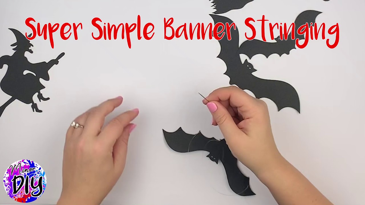 Stringing a Bats and Witches Halloween Banner