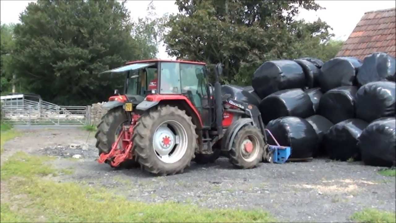 loading and unloading round bales