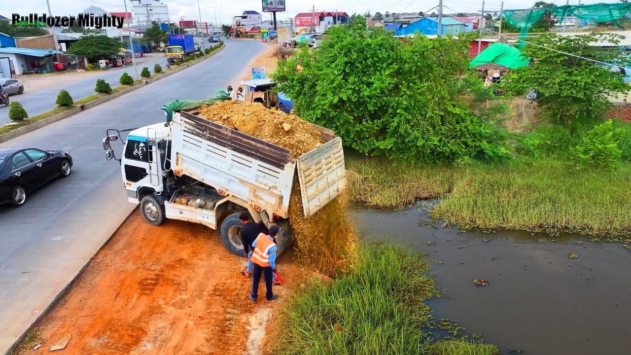 Completed Corner, Full Processing Filling Up The Land huge, Bulldozer KOMATSU D31P, Dump Truck