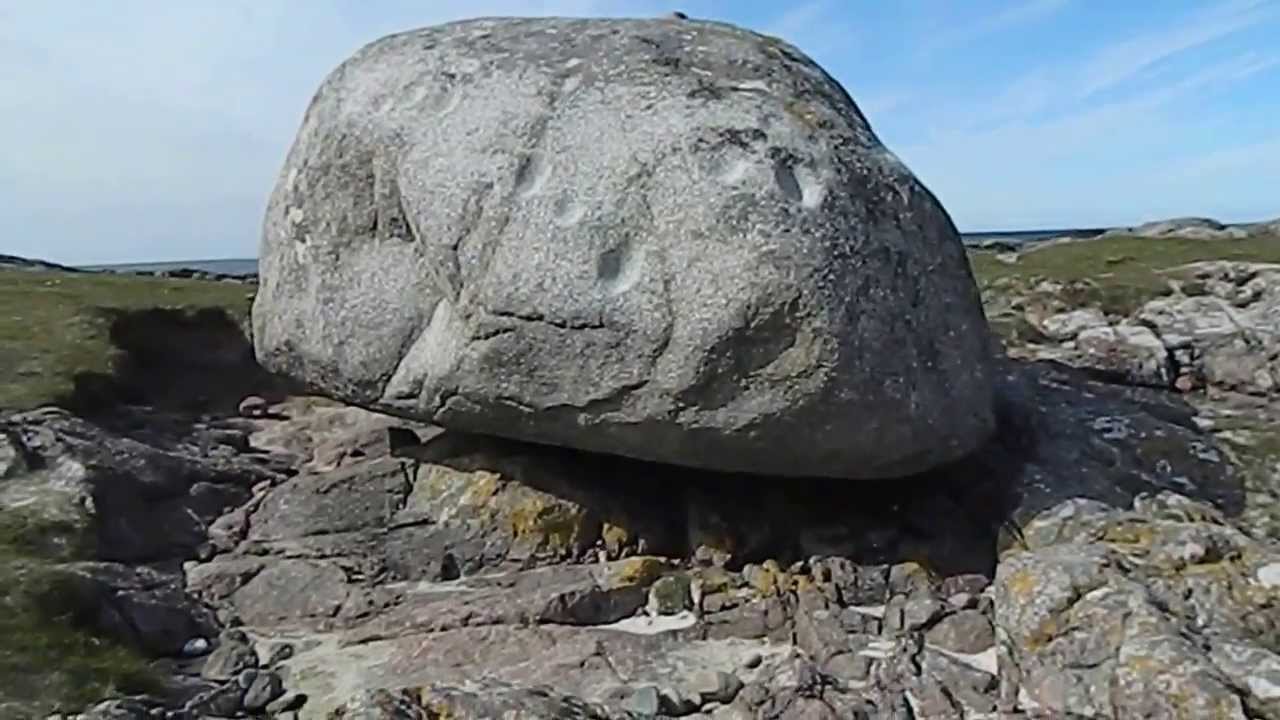 The famous Ringing Stone erratic boulder with stone age cup marks, Isle of Tiree Hebrides Scotland