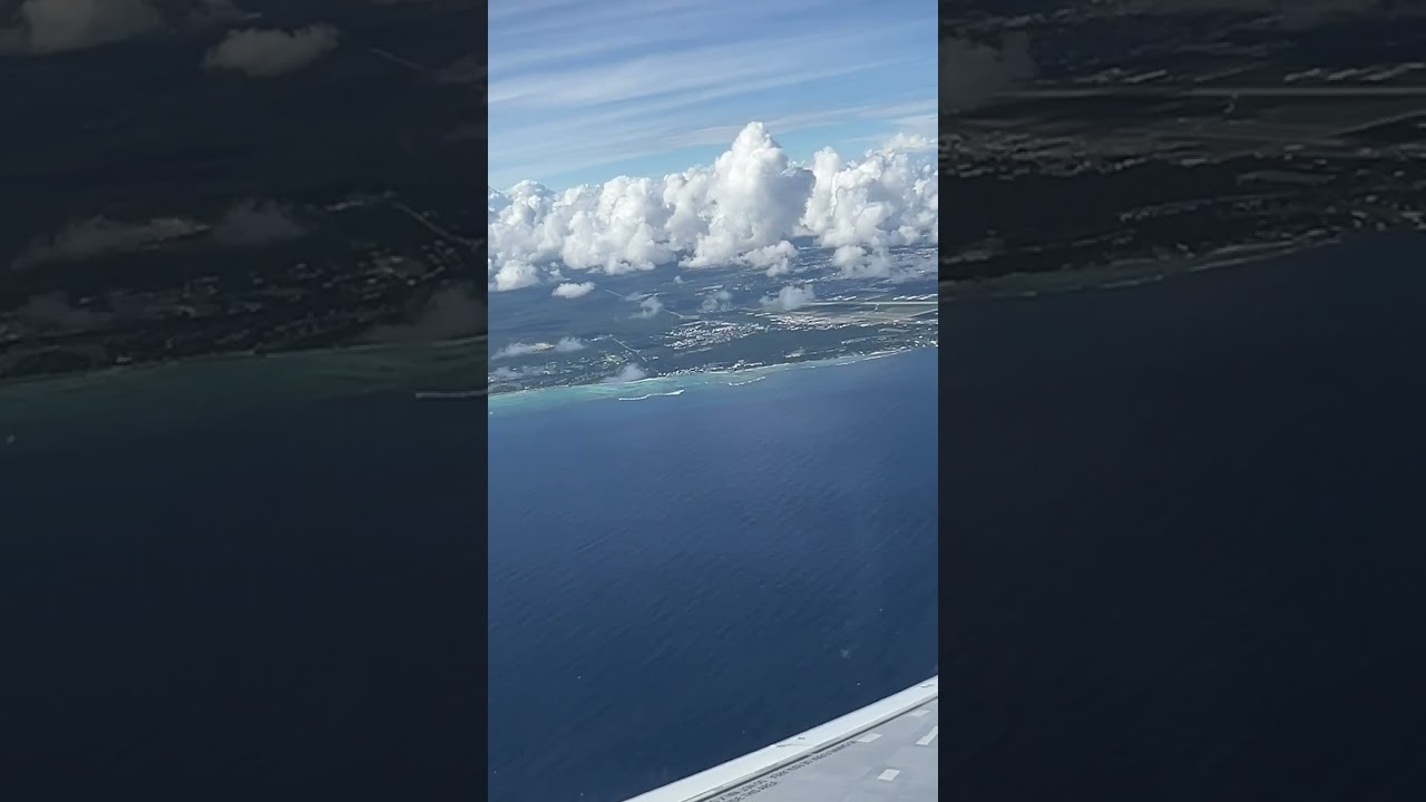 Commercial Flight Window Seat Over The Ocean Waters