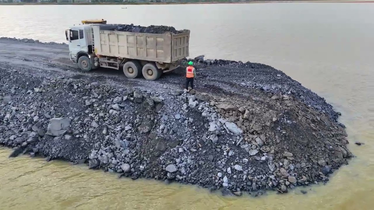 EP02,Fantastic road project Use a truck,wheel loaderand a Dozer Shantui to dump rocks into a sizabl