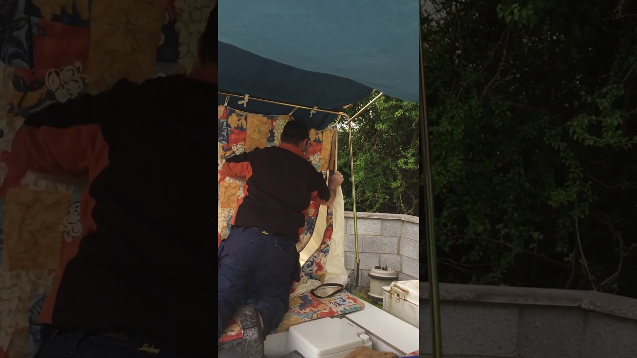Setting up a trailer tent (Conway classic) 2000 pt 4