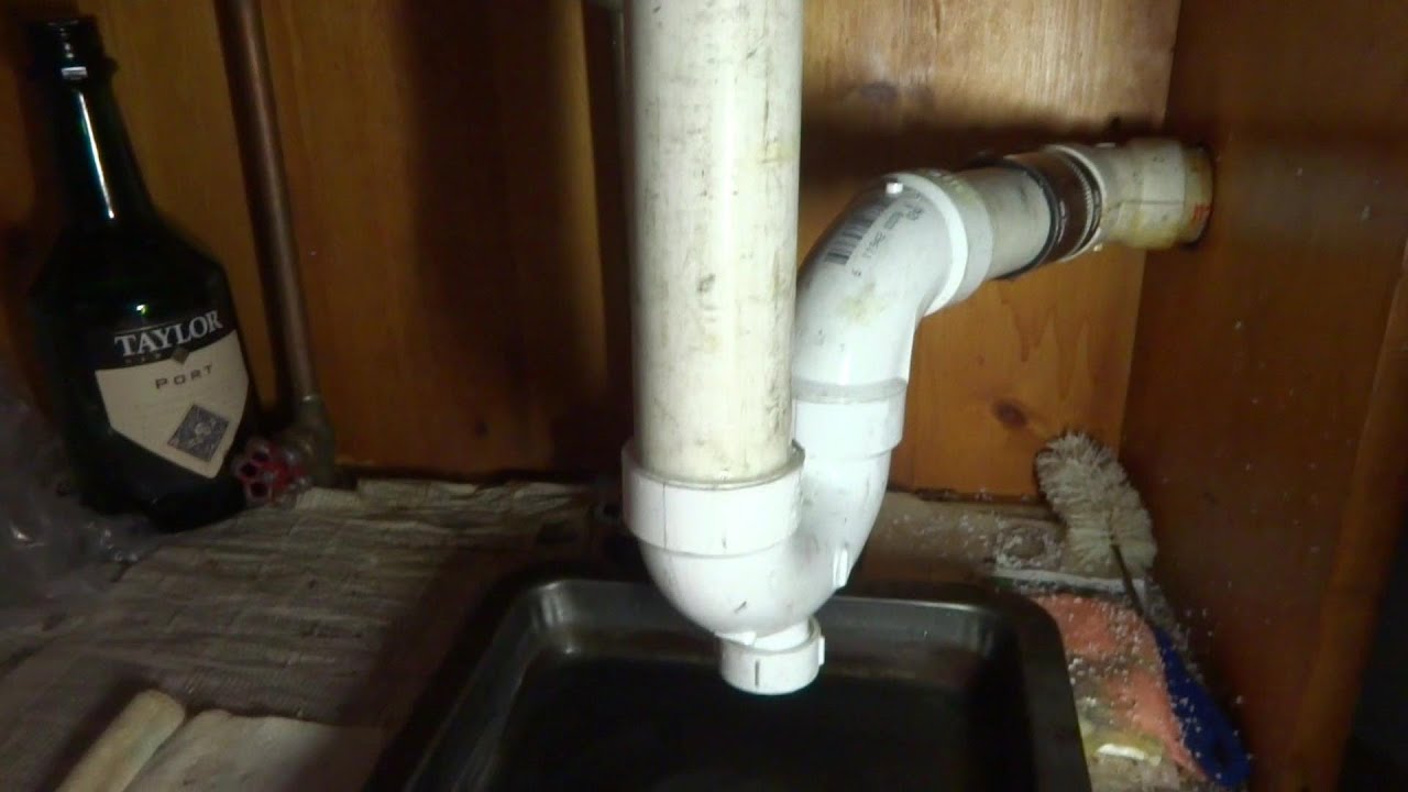 KITCHEN SINK DRAIN PIPING LEAKING AND DRAINING SLOW