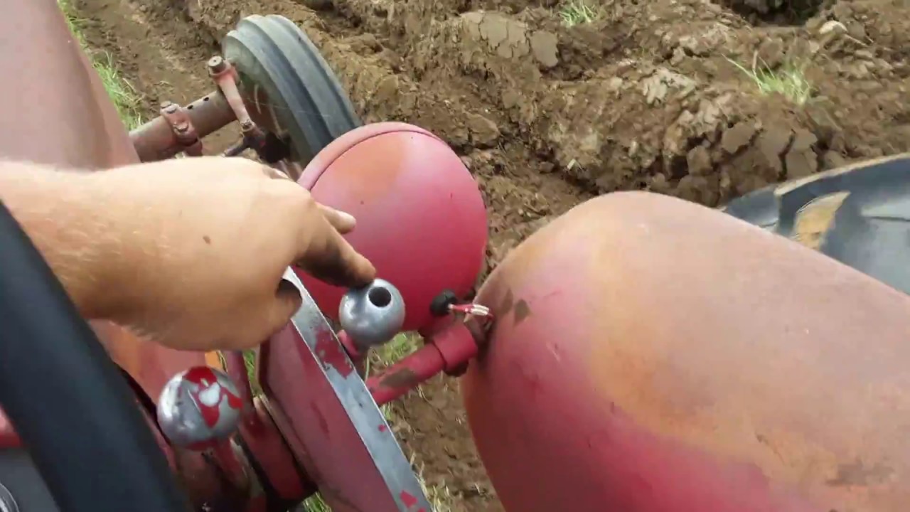 Moldboard plowing sod with a Farmall 560 and a Oliver three bottom plow