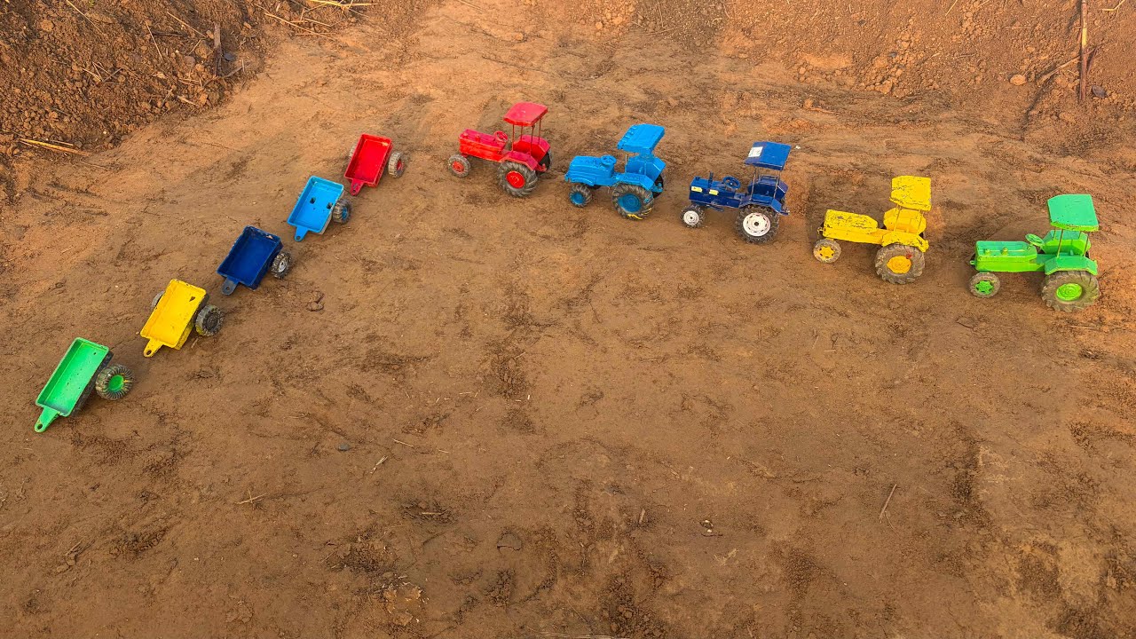 The tractor went to the trailers; the trailers were loaded with heavy soil.#170