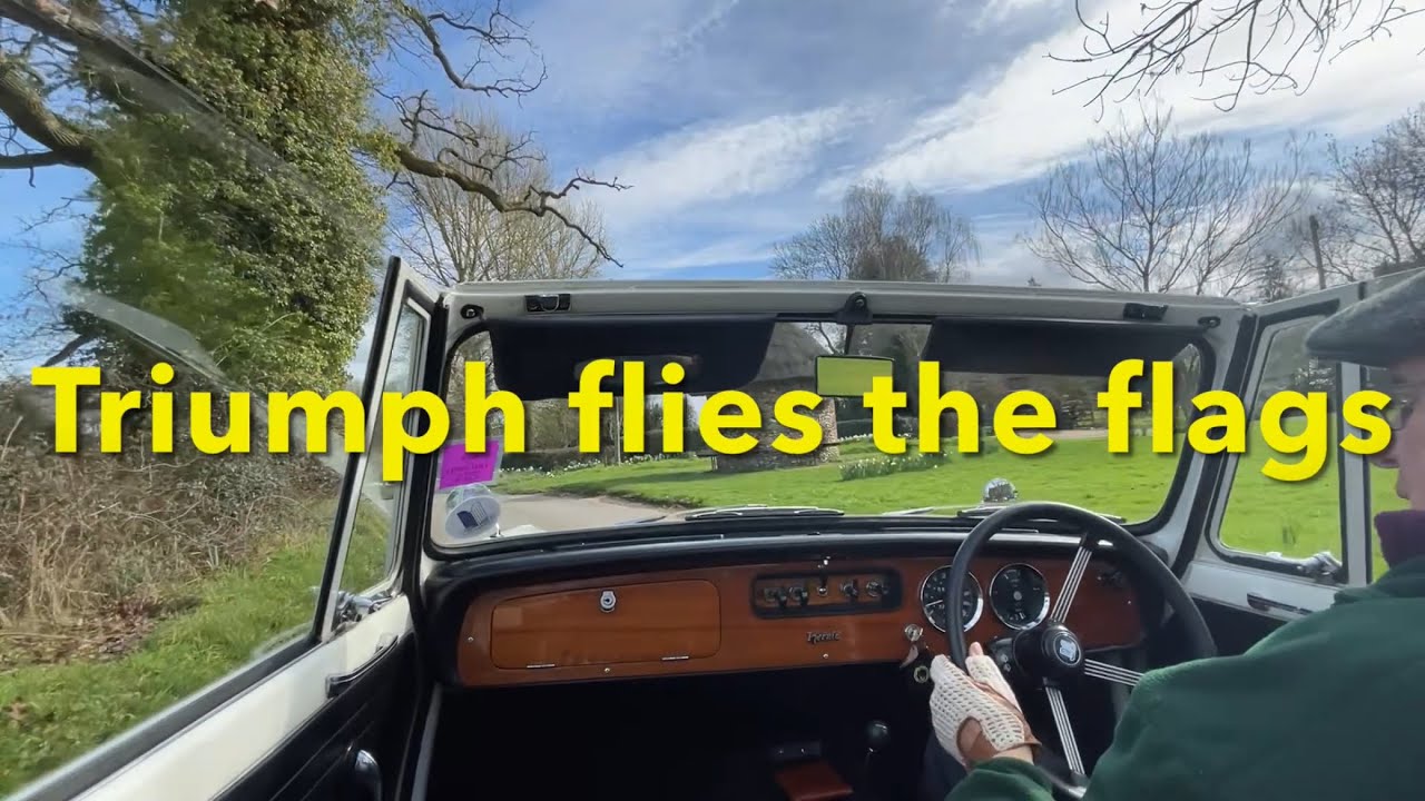 Triumph Herald visits The Arms and flags!