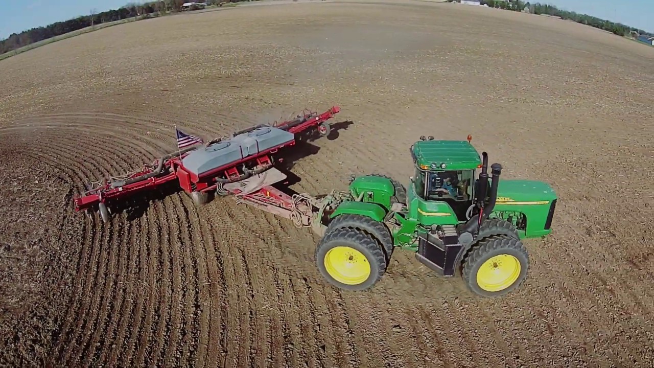 John Deere 9220 tractor pulling a Case 1200 Planter