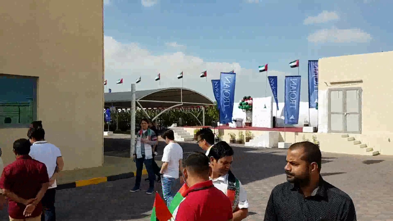 Trojan holding celebrating UAE national day.