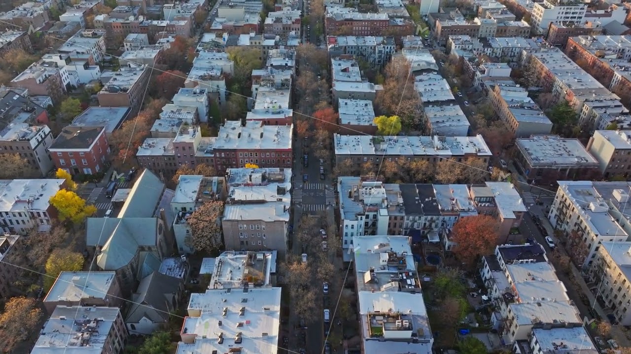 Aerial Brooklyn cityscape revealing geometric street layout with low rise residential buildings