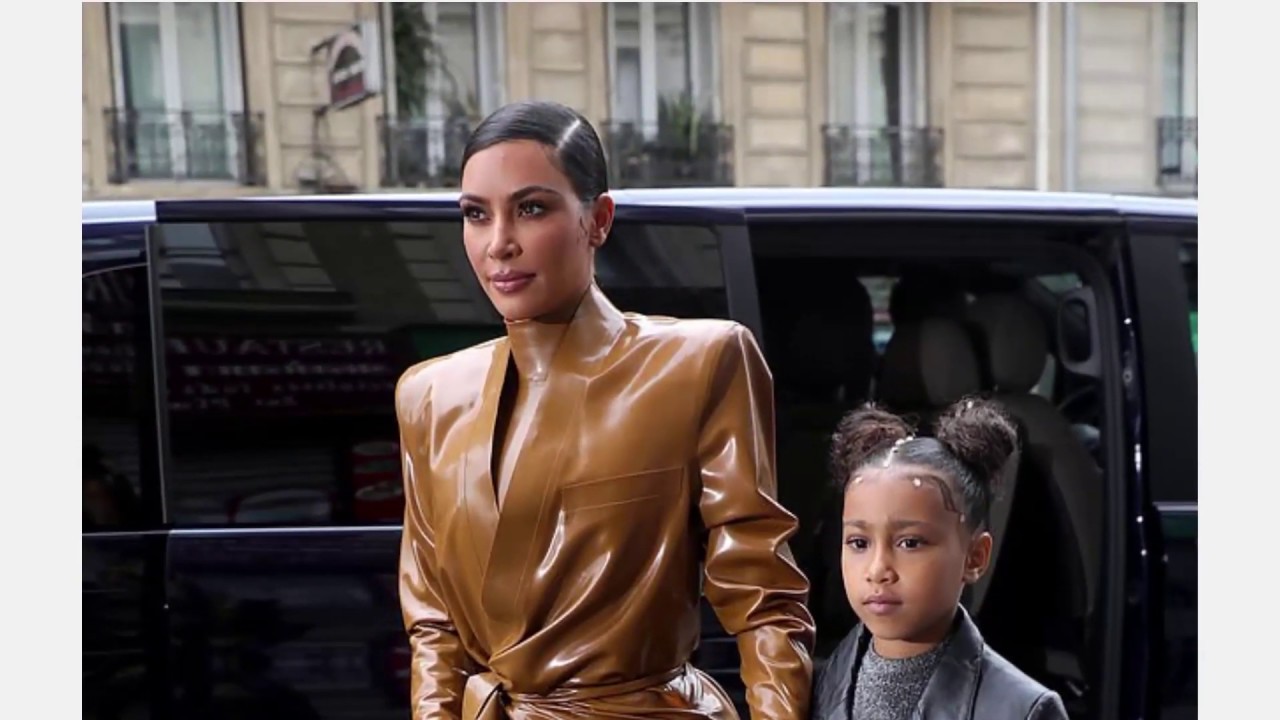 Kim Kardashian showcases a second Balmain brown latex outfit from the designer's show in Paris