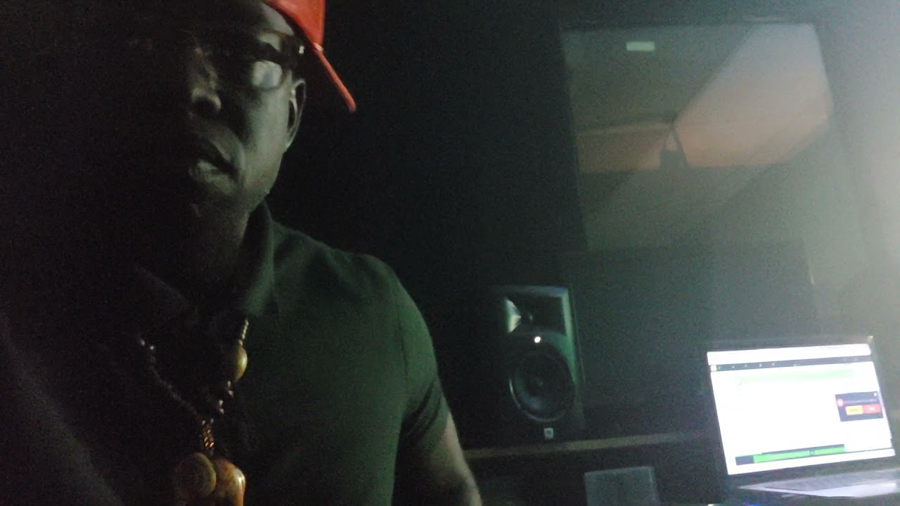 L-Smooth Mensah in studio checking out beats.