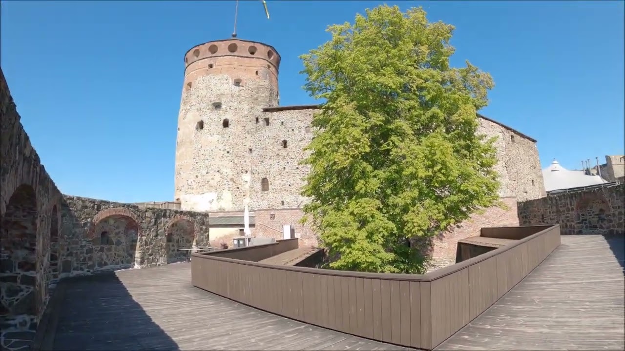 Olavinlinna Castle in summer and winter