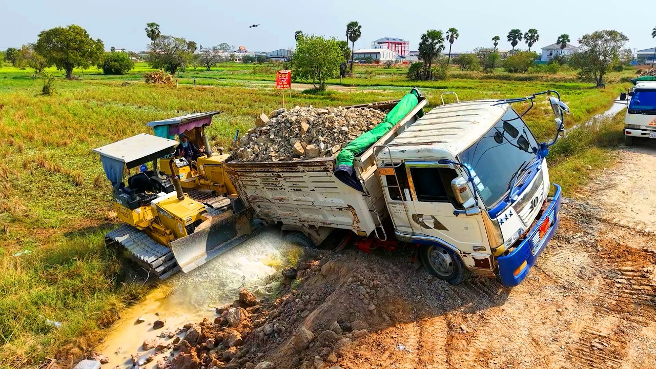 Incredible! Dump Truck stuck, Bulldozer KOMATSU D31P, Land filling process