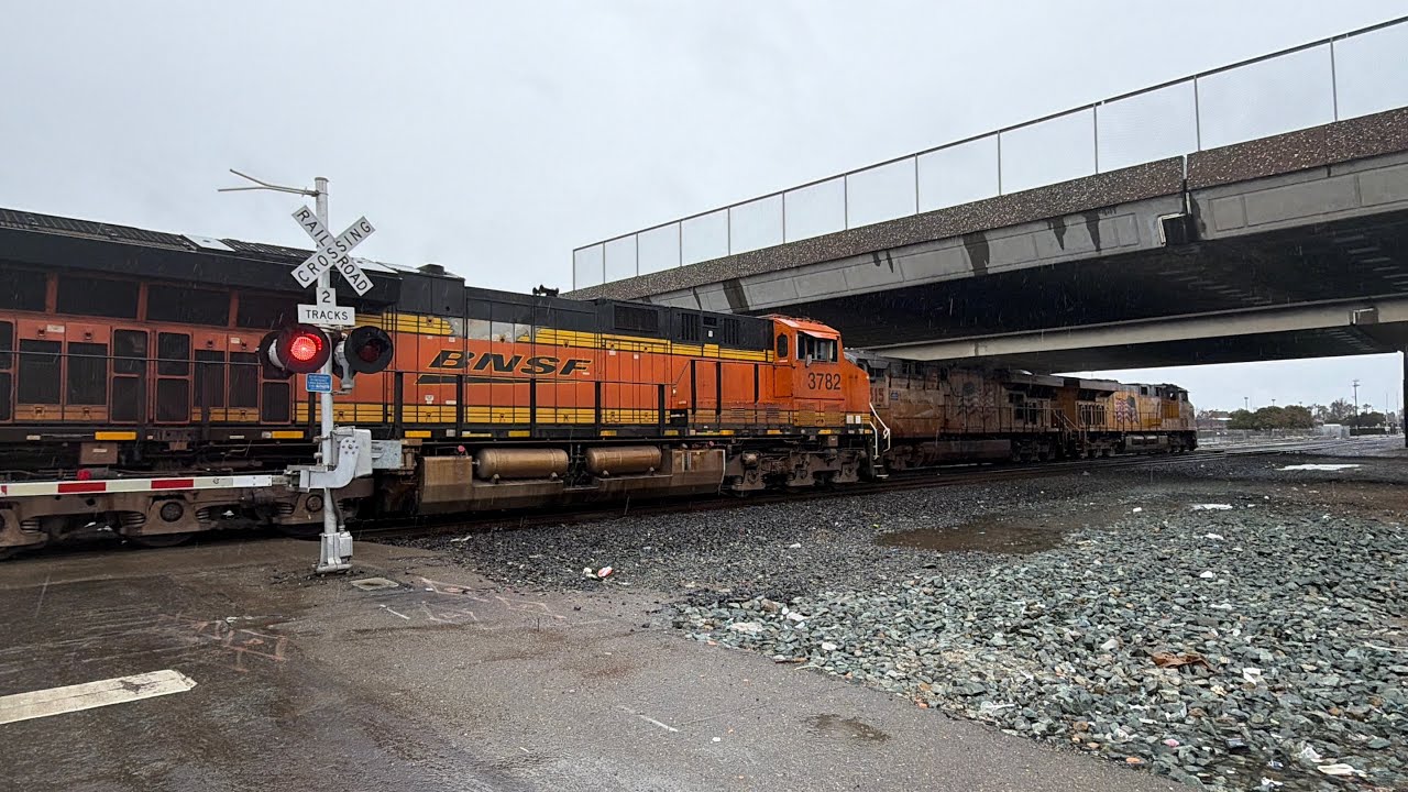 BNSF #7346 lead Stacker train, E Lafayette st Stockton, Meet UP #7860 Lead oil tanker Rainy Day