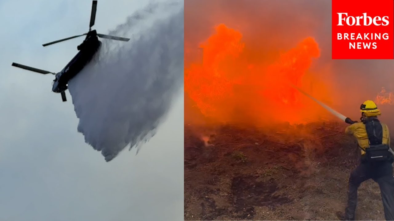 Firefighters Drop Water From Helicopters Onto Roaring Flames As Palisades Fire Races Through LA Area