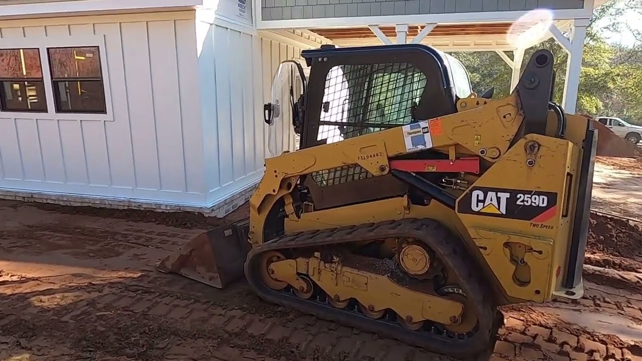 Backfilling and spreading dirt all around my house with my skid steer!