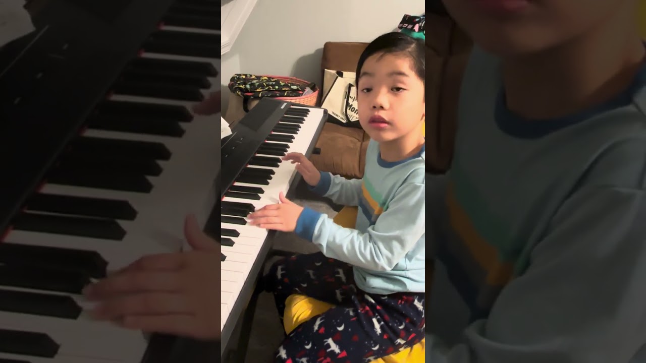 7 year old Seth practicing his recital piano piece “Jurassic Park Theme” 