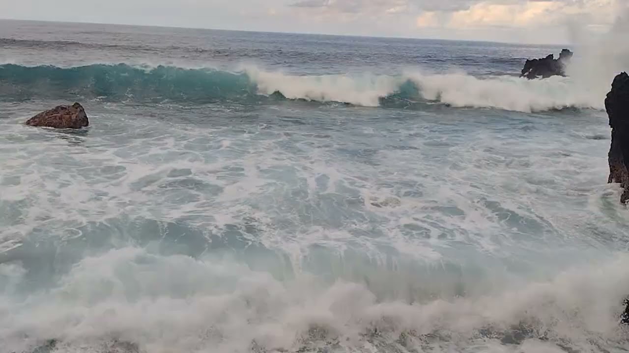 Waves crashing into a rock Beach, relaxing sounds calming sights.