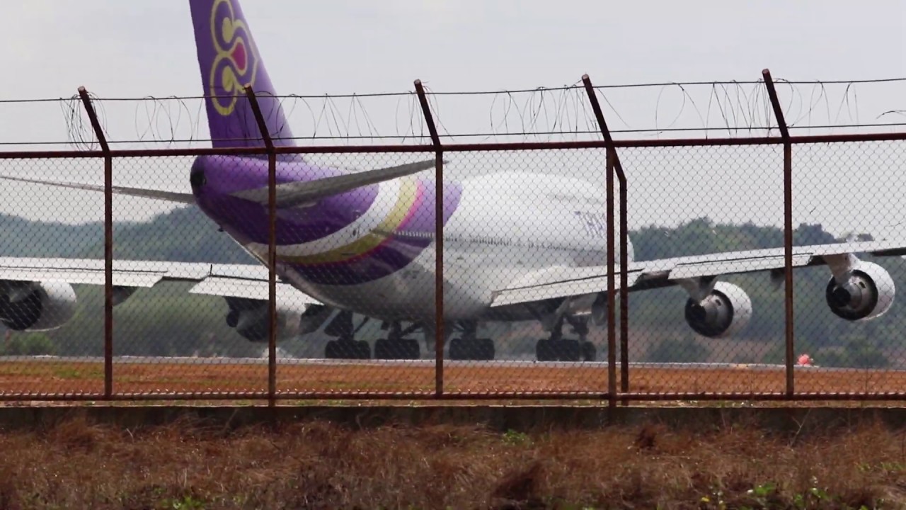 Thai Airways Boeing 747 Extreme Jet Blast blowing at Maikhao Beach Phuket