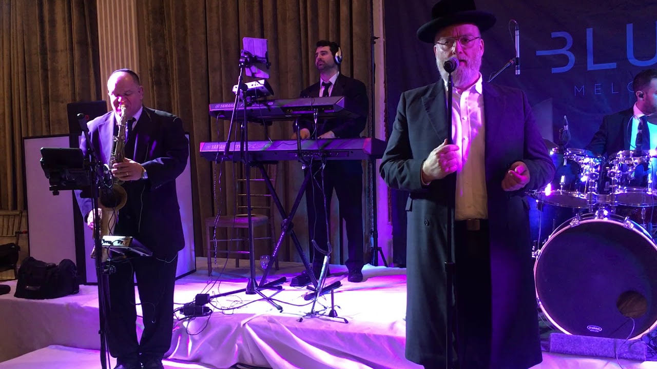 Michoel singing Mimini Michoel and more, at a wedding with the Blue Meody Band.