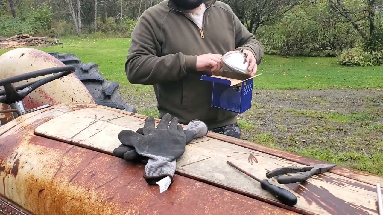 Ferguson TO35 tractor replacing the headlight, Is it a Massey Ferguson?