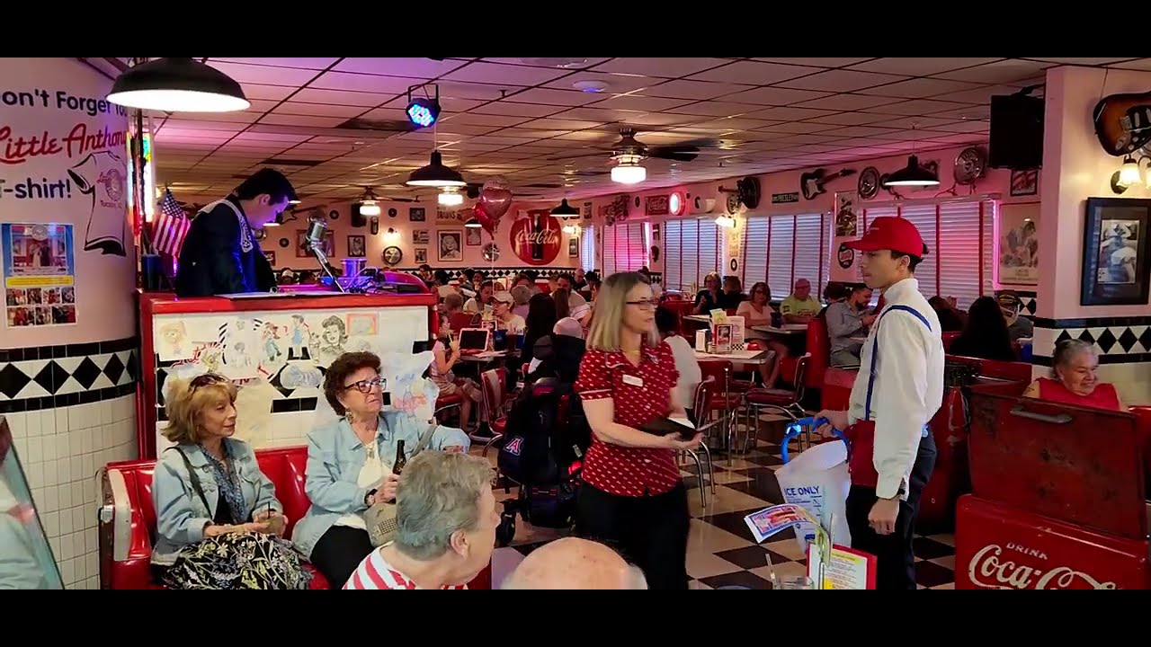 Marilyn singing , oh pretty baby.