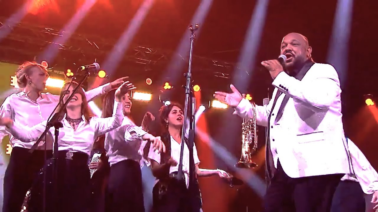 Ladies of Balkan Lab Orchestra dancing 