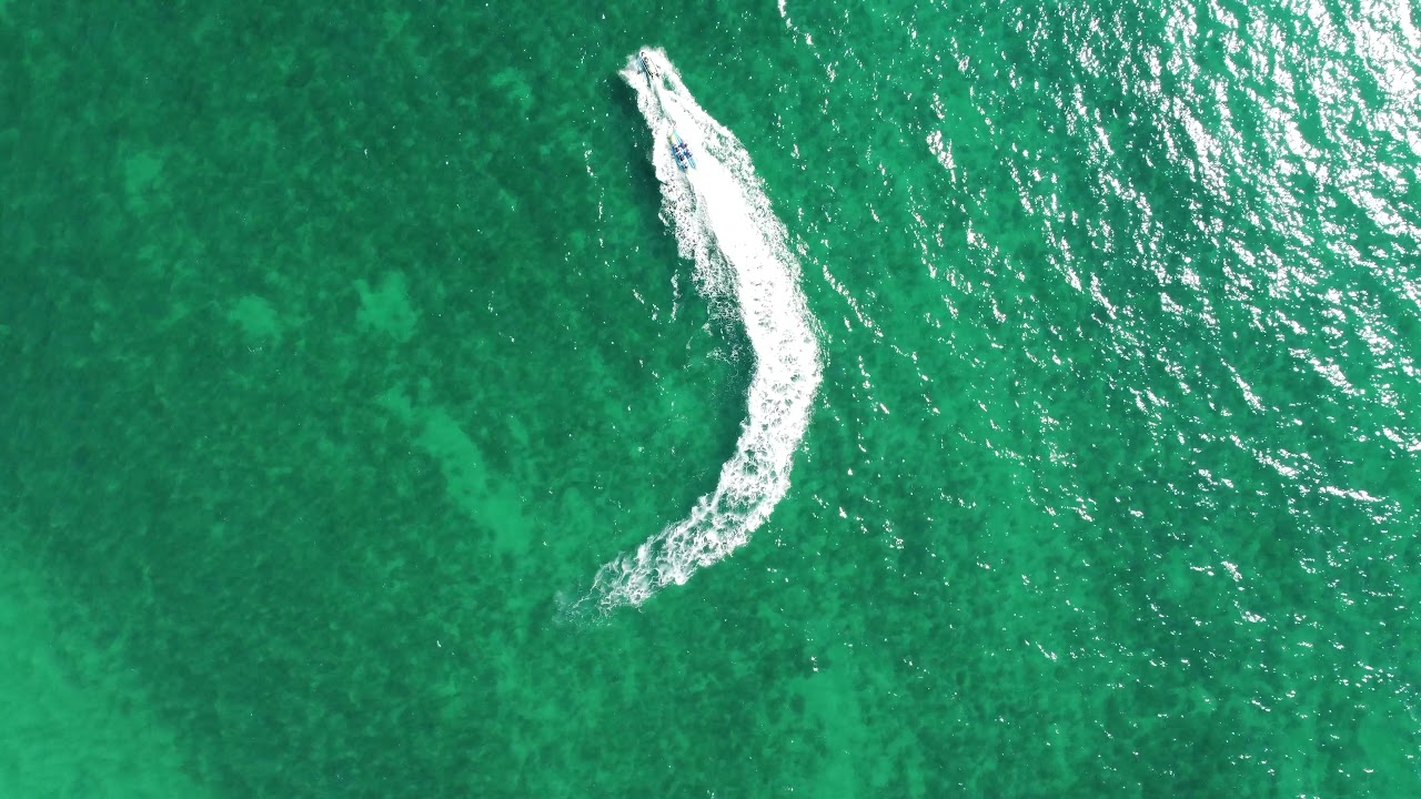 DJI Mini 2 Droning Over the  beach and Atlantic and capturing a Banana Boat 