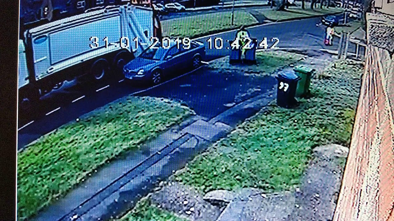 Biffa Operator throwing refuse bin into refuse truck