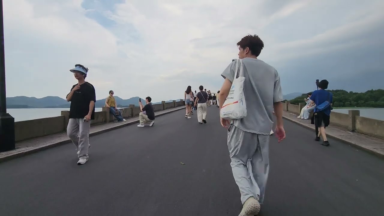 Crossing the Long Bridge Bai Causeway 白堤 Xihu West Lake Hangzhou China 西湖 杭州 中国