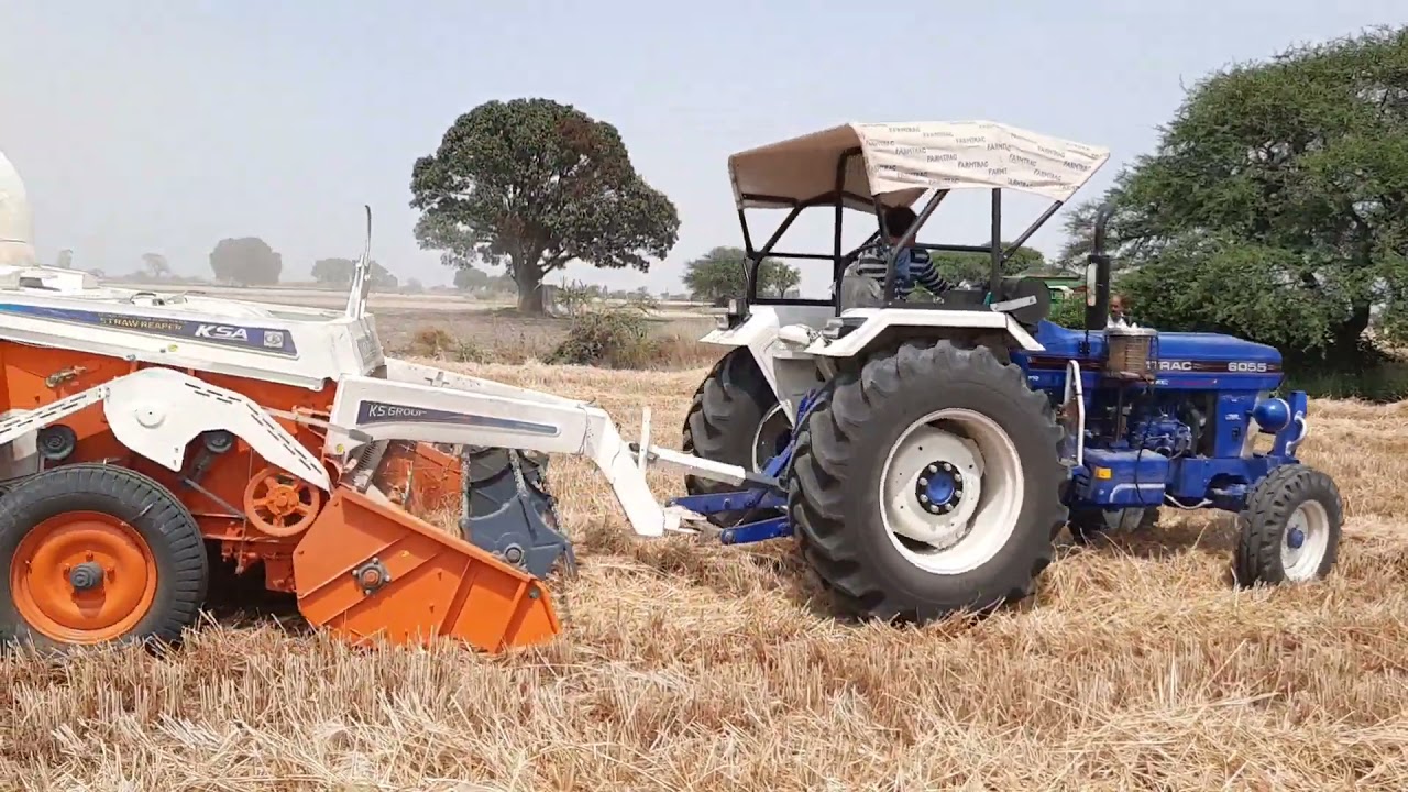 Farmtrac 6055 powermaxx on Straw reaper KSA