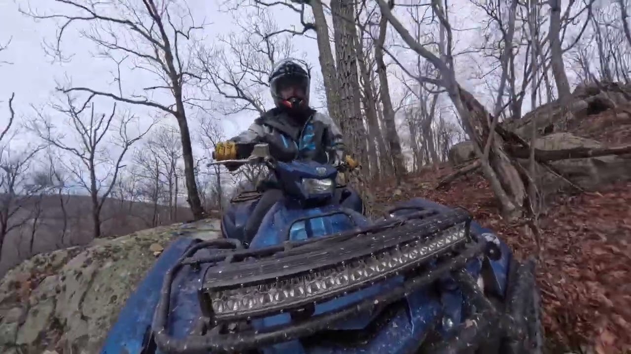 End of winter quad ride. Grizzly Scrambler Sportsman stream mud snow rocks water hills