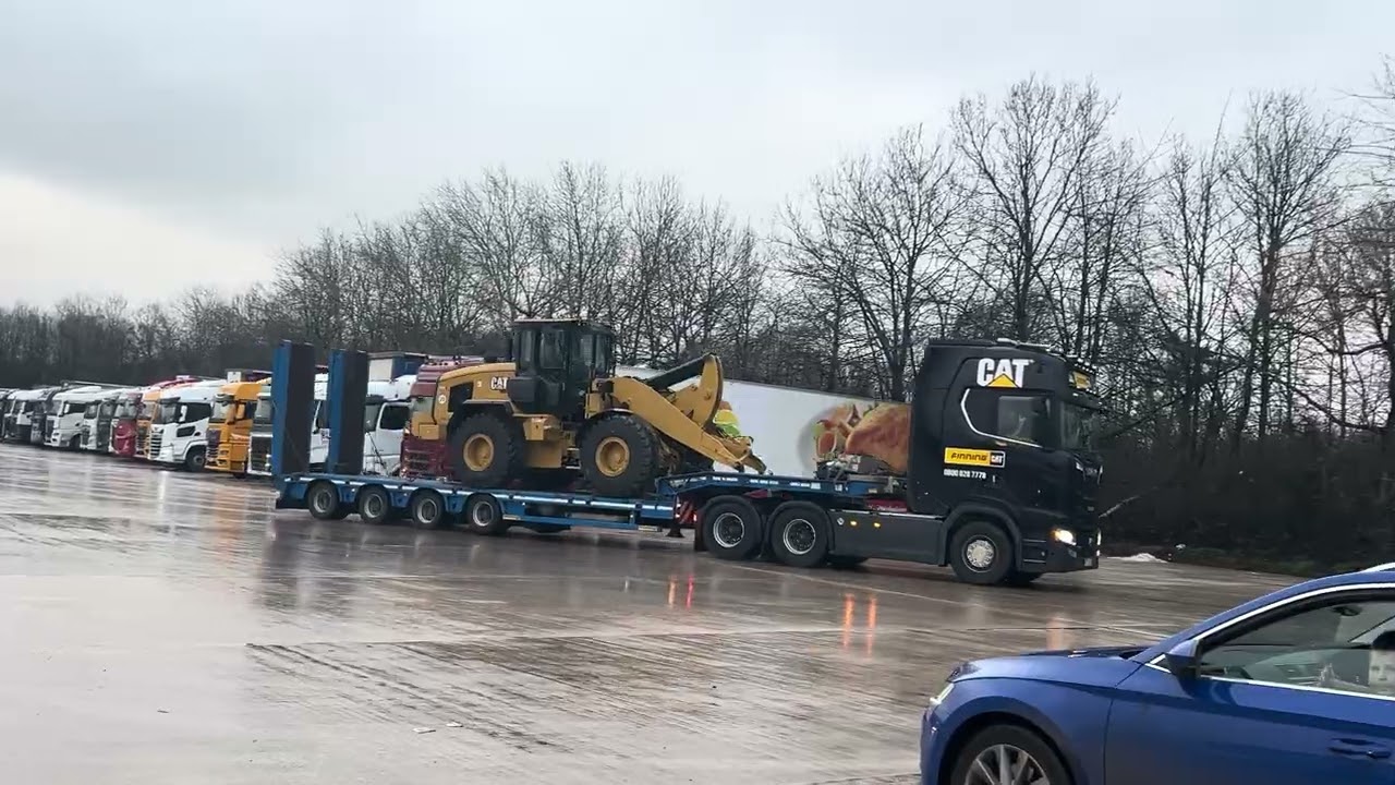 Cat heavy haulage truck and white scania with Turkish whistle air horn leaving lymm services