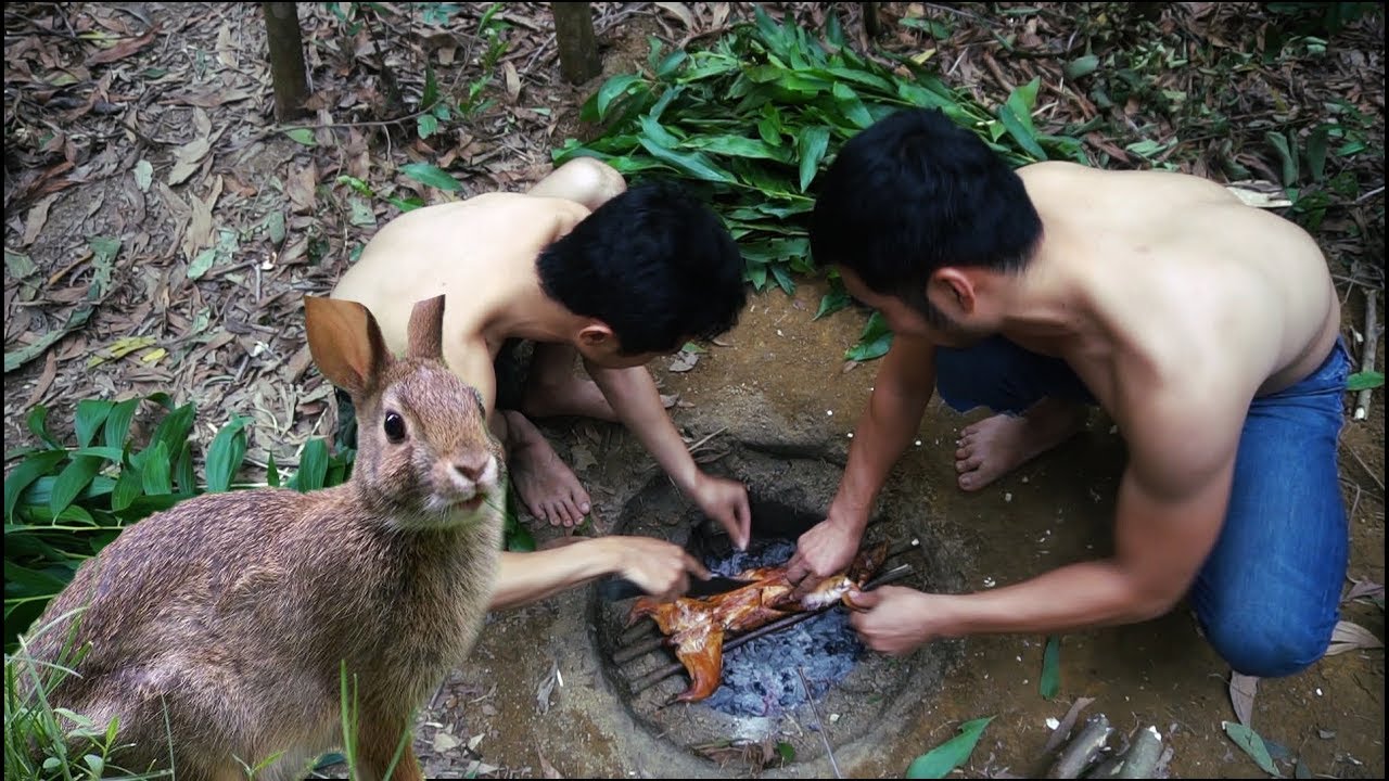 Primitive Technology 10 |  Two natives catch rabbits and bake
