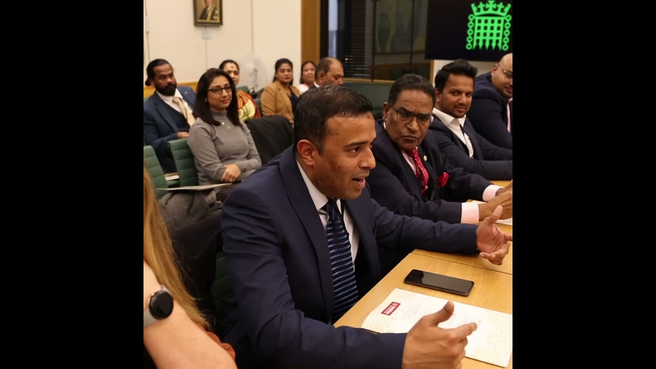 Mr. Joy Alukkas presenting his autobiography 'Spreading Joy' at the British Parliament