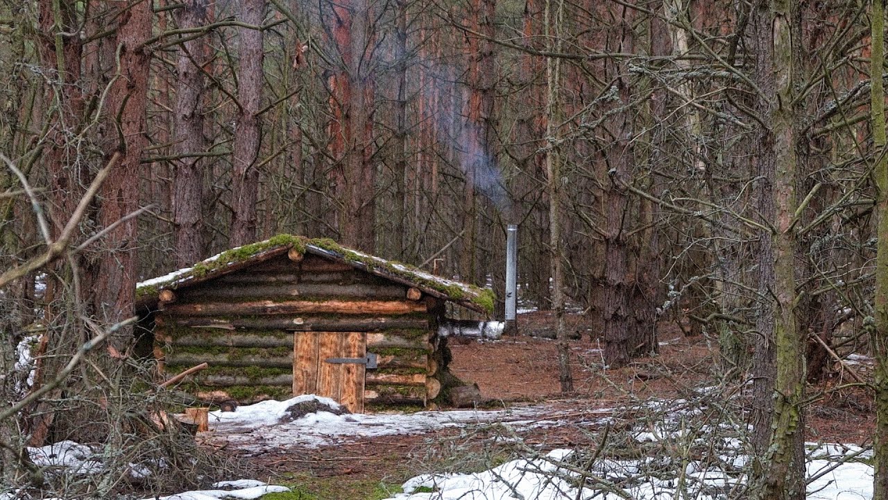 Warm dugout with a stove in a winter forest, ASMR bushcraft shelter building