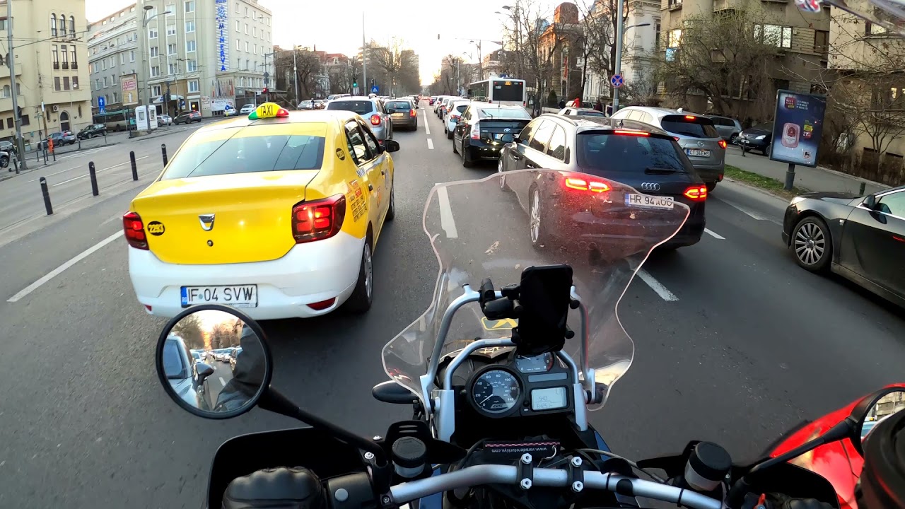 Beginner rider on BMW R1200GS in Bucharest rush hour traffic
