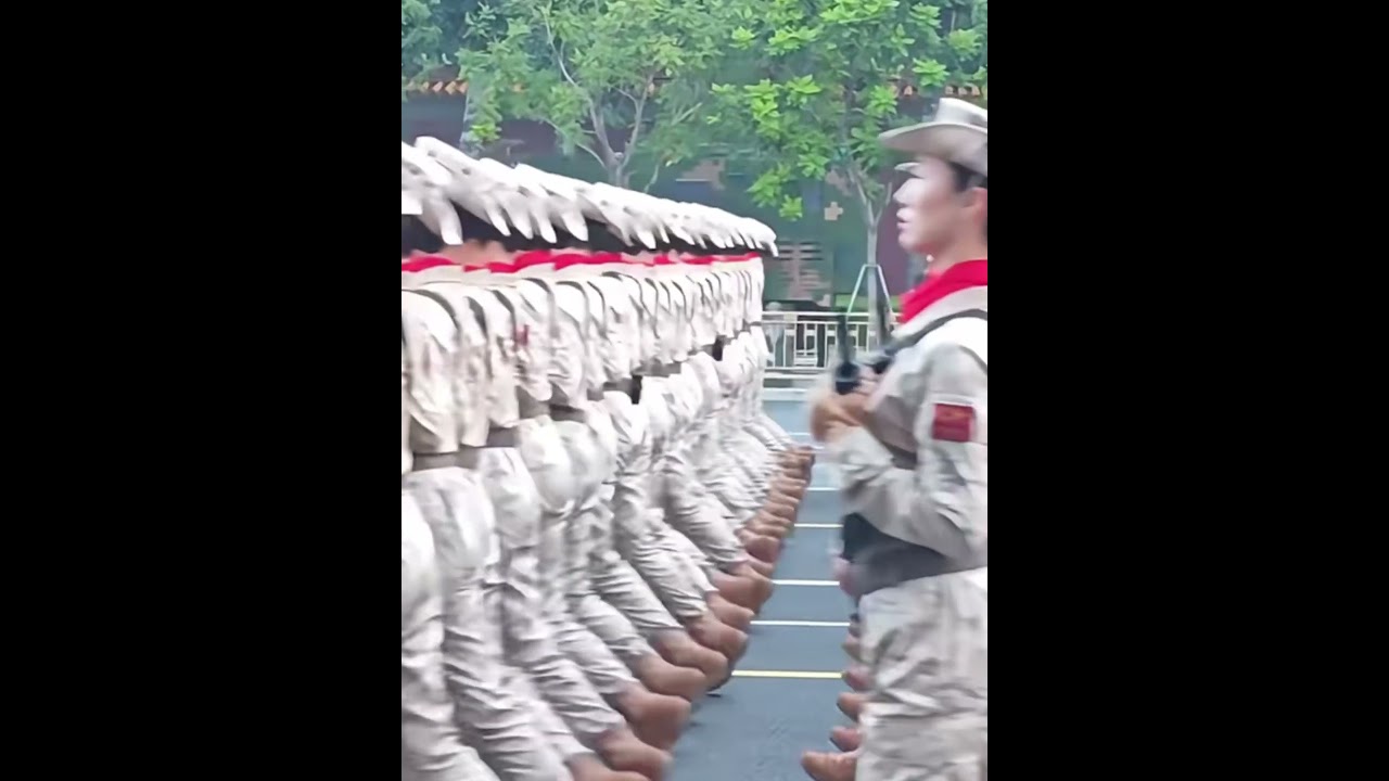 These female militia members march in perfect unison, moving as one during Beijing's V-Day parade.