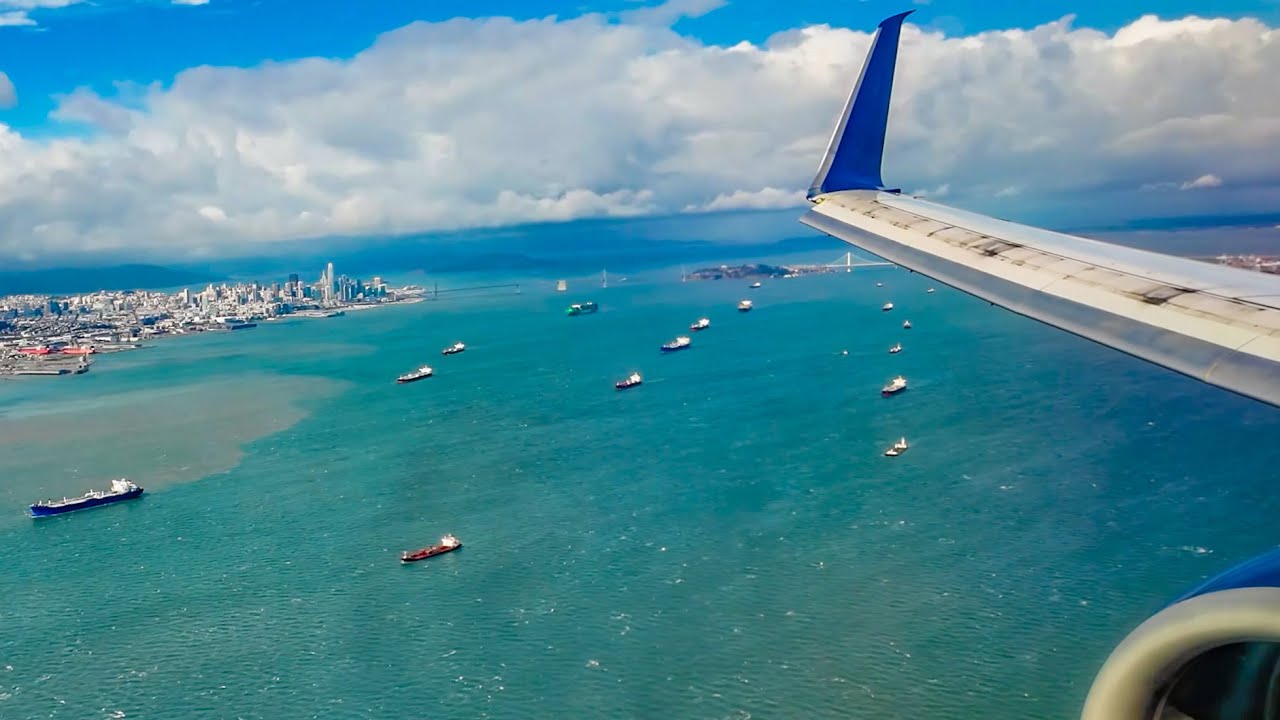 RARE LANDING ON 19L AT SFO - NICE VIEW OF SAN FRANCISCO AFTER BREAKING THROUGH LOW CLOUDS - W/ ATC