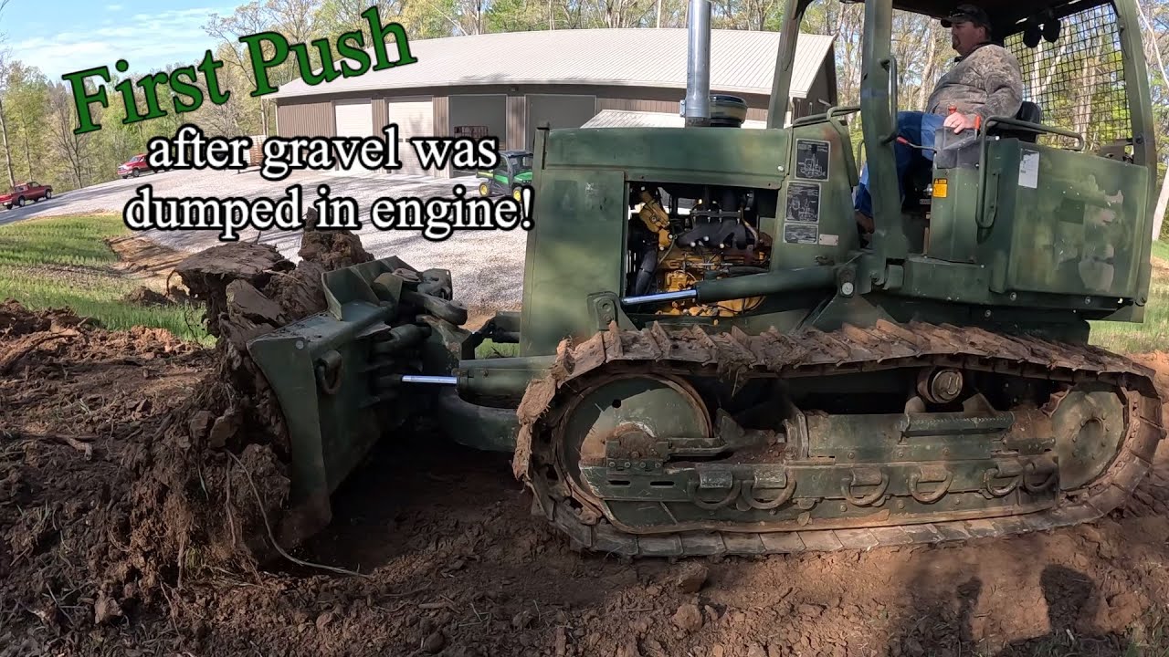 After having gravel dumped into its engine we take the John Deere 450G dozer out to the dirt